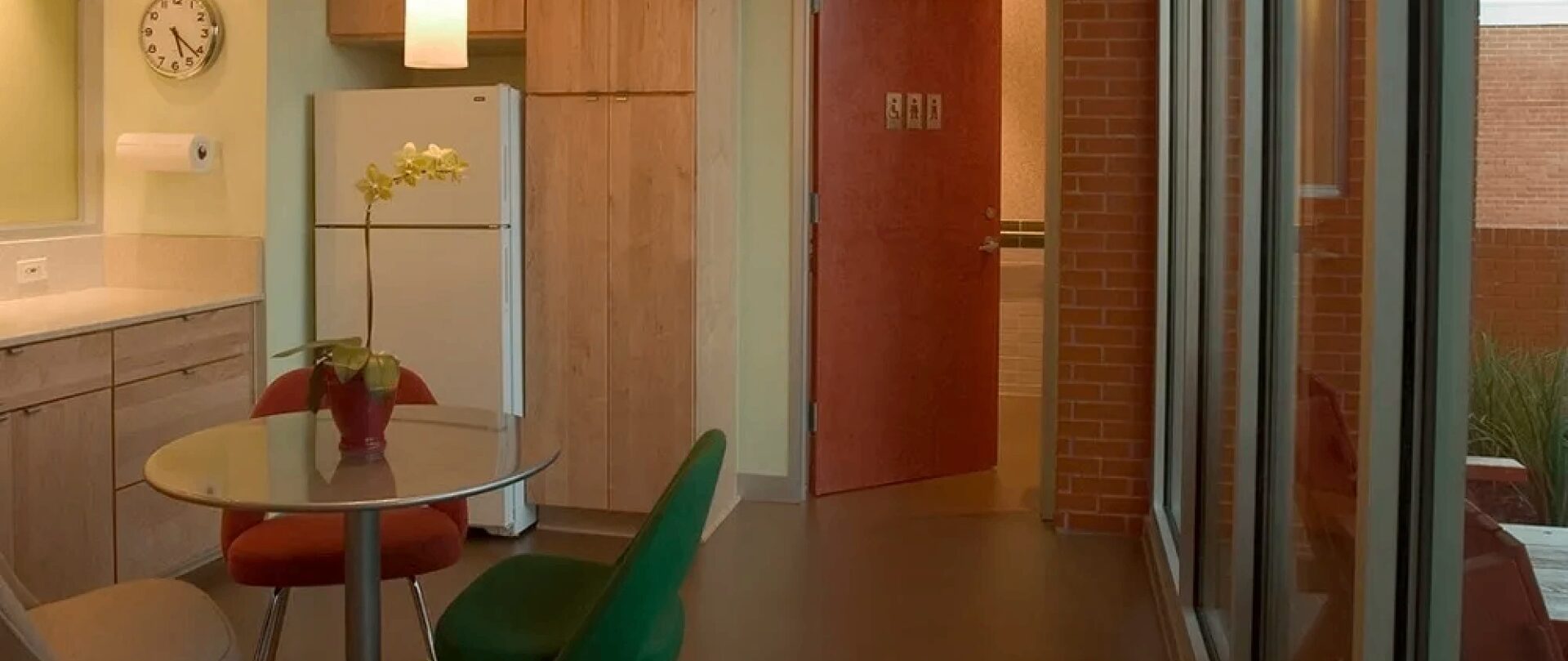 Modern kitchen with table and chairs.