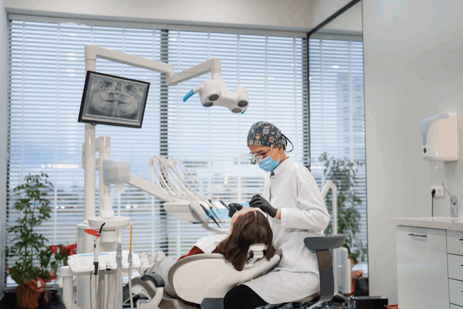 Dentist treating a patient in a modern clinic.